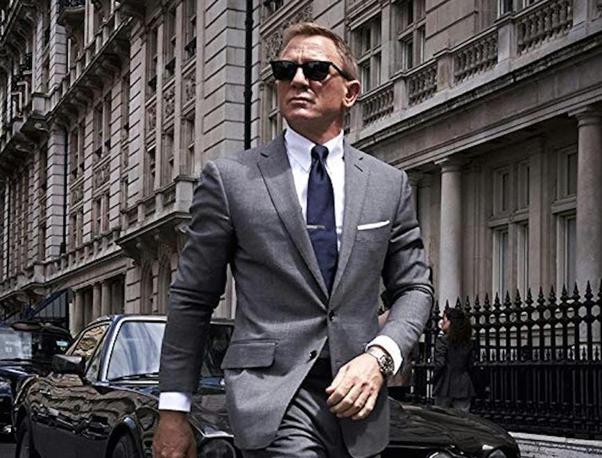 clothing apparel suit overcoat coat person human man sunglasses accessories