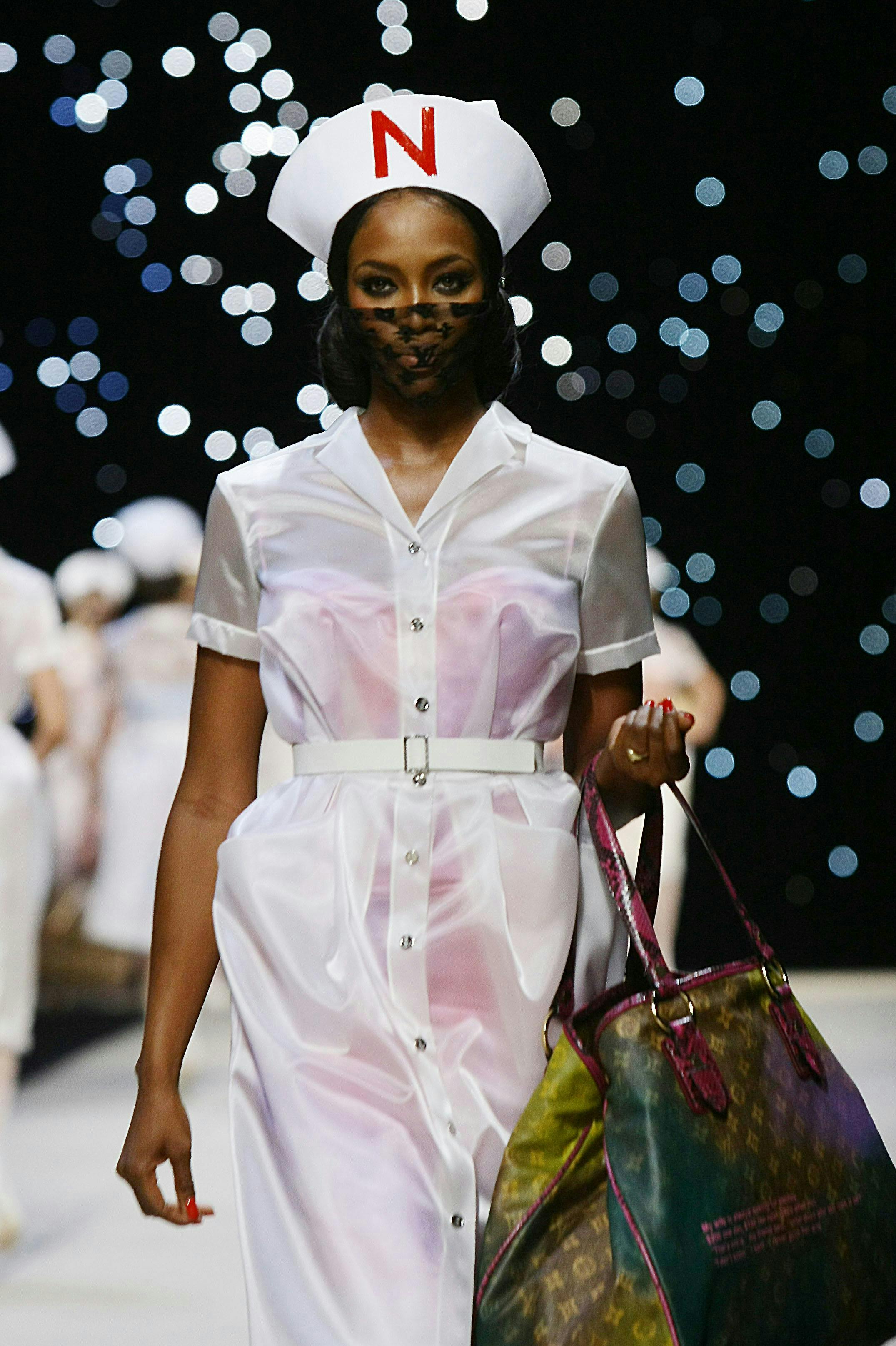 fashion design:cb1,fashion runway:cb1,fashion model:cb1,celebrit person human handbag accessories bag accessory
