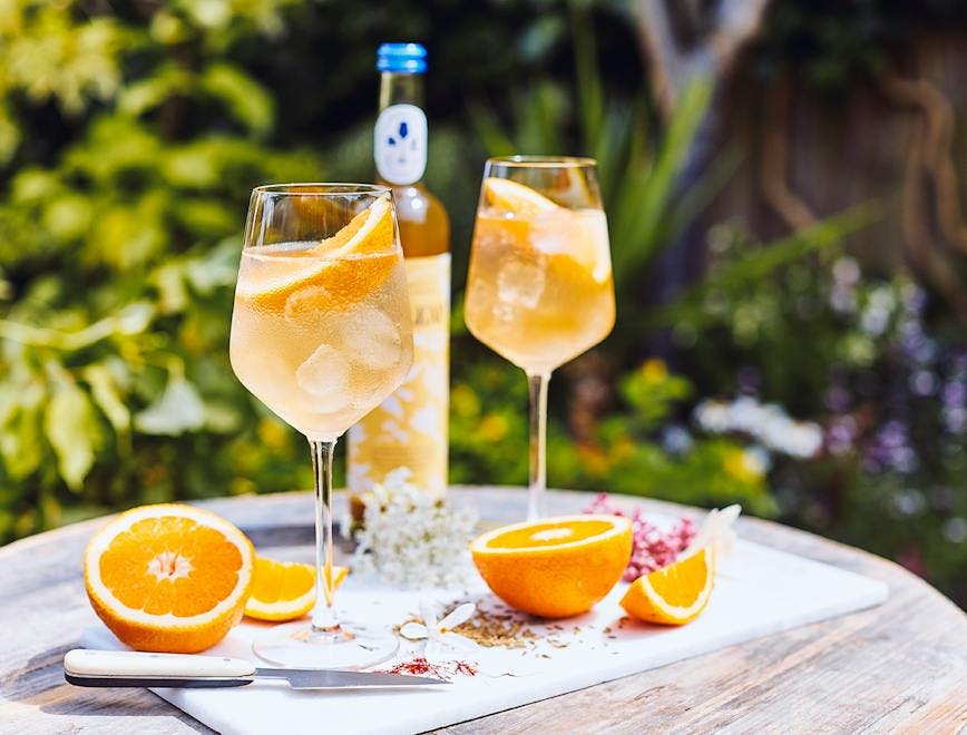 plant citrus fruit fruit food cocktail beverage alcohol orange glass grapefruit