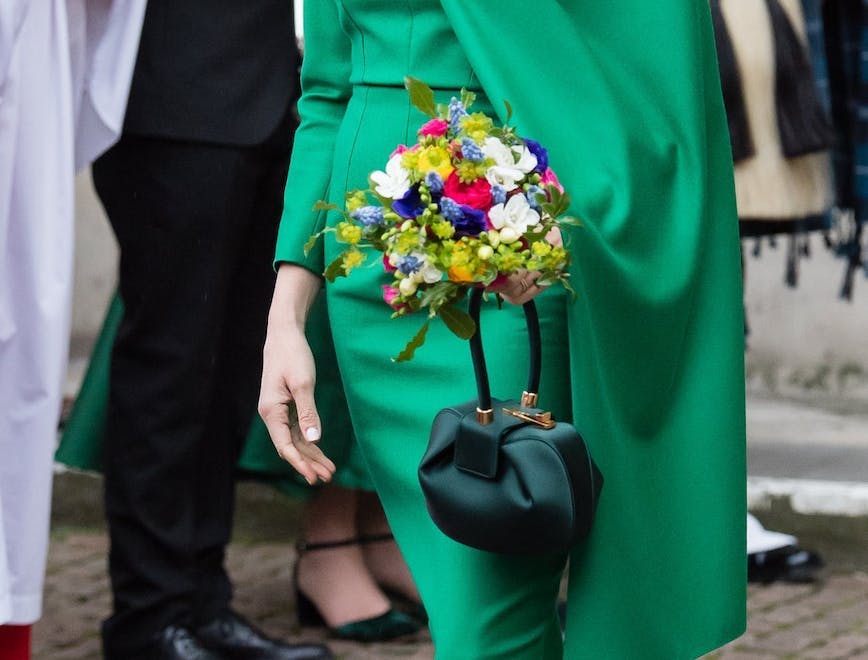 clothing plant shoe footwear person flower bouquet flower flower arrangement sleeve long sleeve