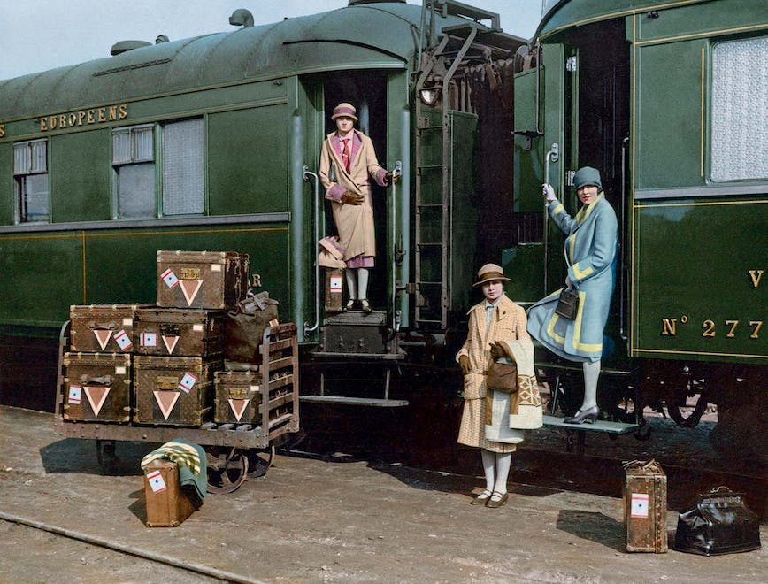 coat clothing apparel person human train transportation vehicle locomotive