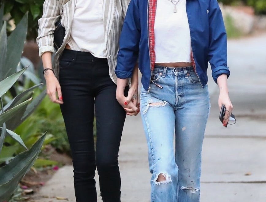 clothing pants person shoe footwear blonde female sunglasses accessories jeans