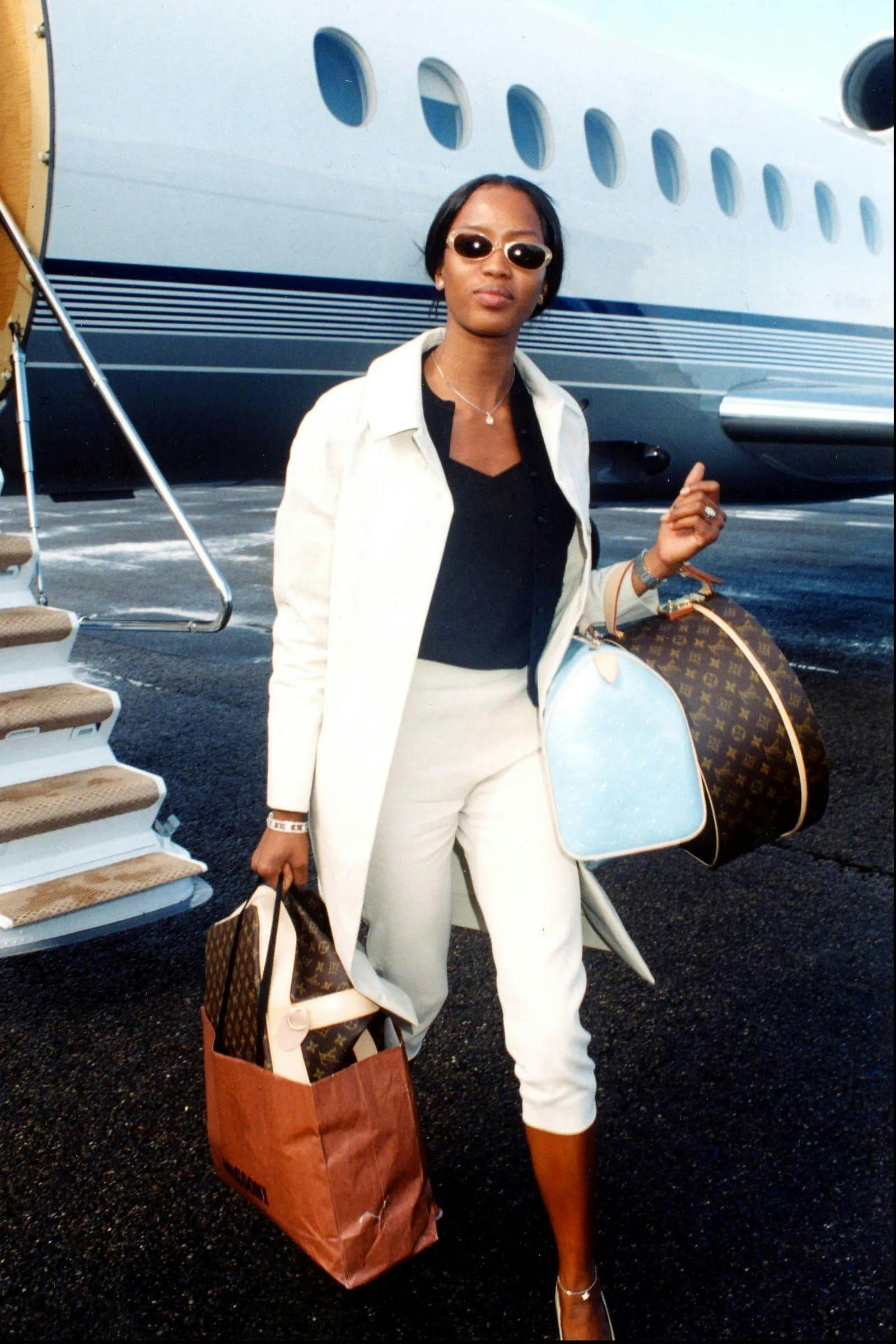 handbag bag accessories sleeve clothing apparel long sleeve person human sunglasses