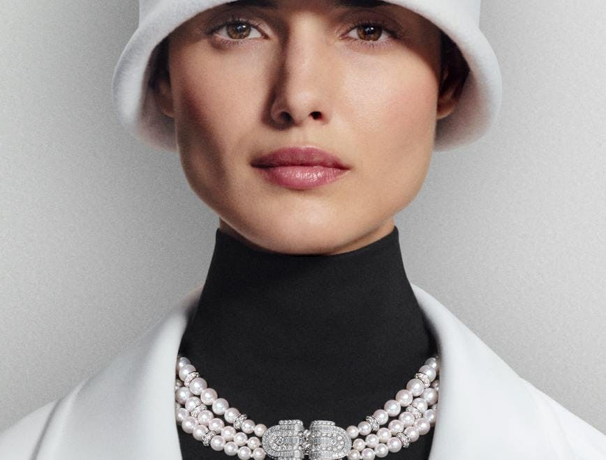 necklace accessories jewelry coat face person woman adult female hat