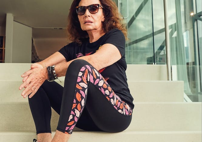person sitting footwear shoe adult female woman accessories sunglasses sneaker